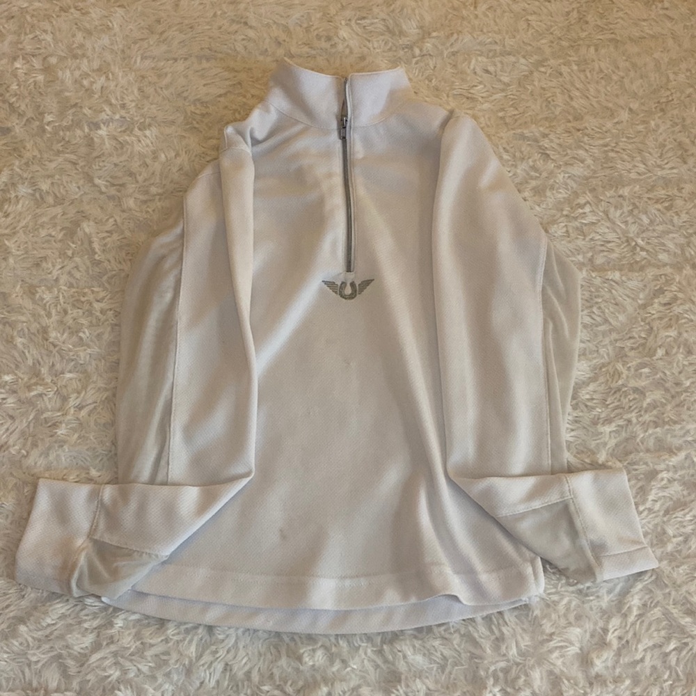 Tuffrider vented long sleeve. Has small stain on the bottom. Not noticeable